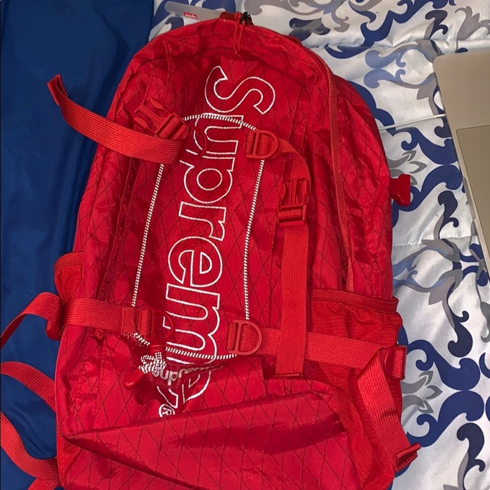 Supreme red bookbag with key chain